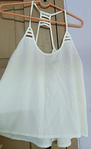 White sleeveless top