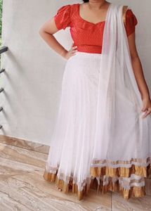 White Net Lehanga And Red Prince Cut Blouse