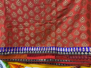 YELLOW ORANGE SHIFFON AND HEAVY EMBROIDERY SAREE