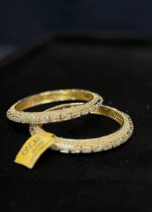 Oscar golden bangles