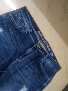 Distressed Blue Denim Jeans