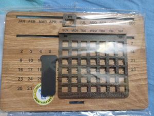 Absolutely new Wooden  Calendar ,pen and a woode