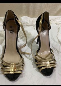 Black Heel With Gold Straps