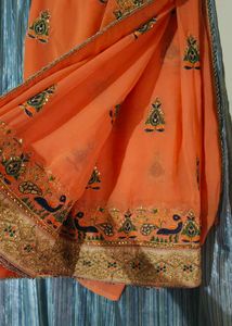 Elegant Orange Embroidered Saree