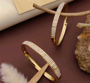 Gold Tone Flower Bangle Set