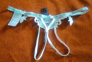 Unisex Lacy White Thong with Charm