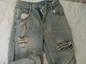 damaged jeans .
