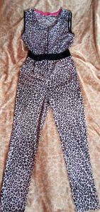 Leather print jumpsuit with a  zipper on top.