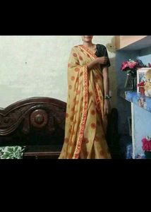 Elegant Beige Saree with Red Accents