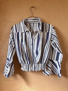 White Top With The Blue Strips On It