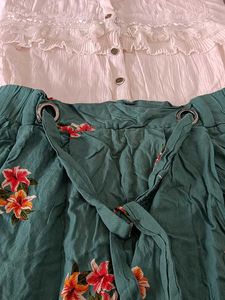 This Is A Flared Dress With Lily Print On It