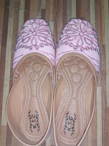 pair of traditional pink embroidered juttis