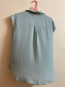 Light Blue Sleeveless Button-Down