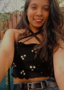 "This chic black stretchable top hugs the body per