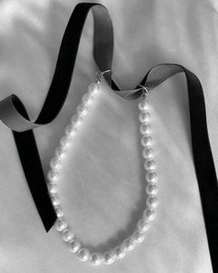 Pearl choker with black ribbon