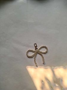 trendy silver bow bag charm 🦢