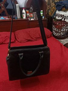 Pure Leather Black Handbag.