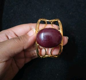Gold Tone Cuff Bracelet with Maroon Stone