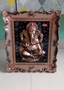 Divine Ganesha Idol in Ornate Frame