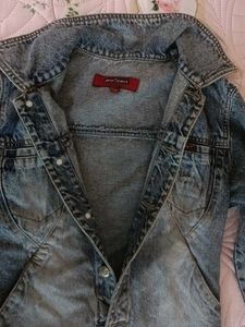 brand new slightly ripped denim jacket