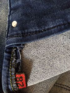 Skinny Blue Jeans With Distressed Pattern