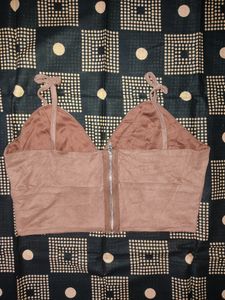 chocolate brown crop top with black corset style top