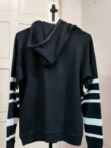 💥BUY1GET1💥 black hooded sweatshirt with white stripes on the sleeves.