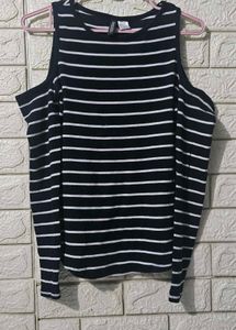 H&M  Black and white striped cold-shoulder top.