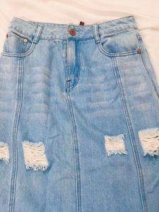 DISTRESSED DENIM SKIRT