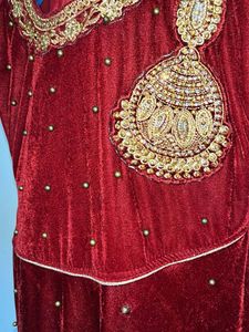 Long maroon Velvet gown With beads Work
