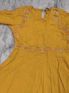 Girls wear Mustard Embroidered A-Line Kurta with s