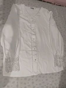 A White Shirt With Pearls