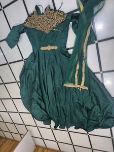 Luxurious Silk Dark Green Gown With Golden Stone