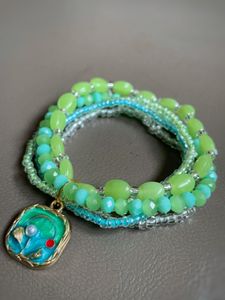 Green Beaded Bracelet with Floral Charm