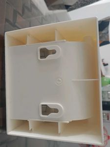 white tissue holder with flat storage on top
