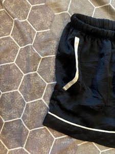 black satin shorts