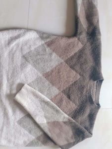 A Cropped Sweater Of Fabric Wool