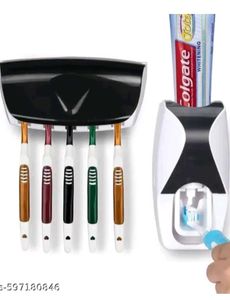 Toothpaste dispenser with toothbrush holder