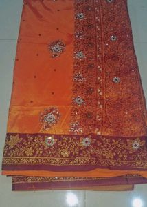 Orange  and maroon Embroidered Saree