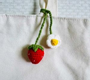 Crochet strawberry and flower charm