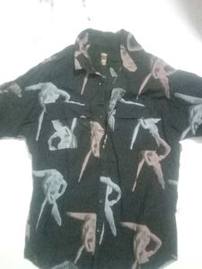 Gray Denim Jeans and a half shoulder shirt.