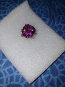 Vibrant purple rose cluster ring with golden Stone