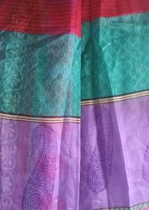 Red, Purple And Green Net Saree.