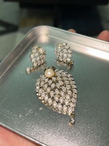 A Set Of Gold Coated Dollar &amp; Earrings