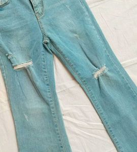 Ripped Fringe Hem Flare Jeans