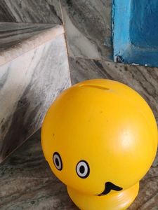 A Small Yellow Smiley Piggy Bank