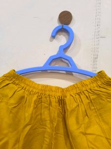 Mustard churidar pant.