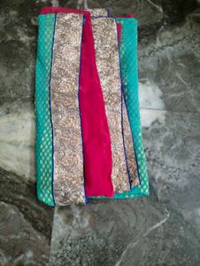 Red &amp;firoja colour saree.
