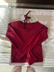 Its A Maroon Colour Crop Top With Long Sleeves
