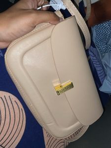 classy beige slingbad/handbag with two belts
